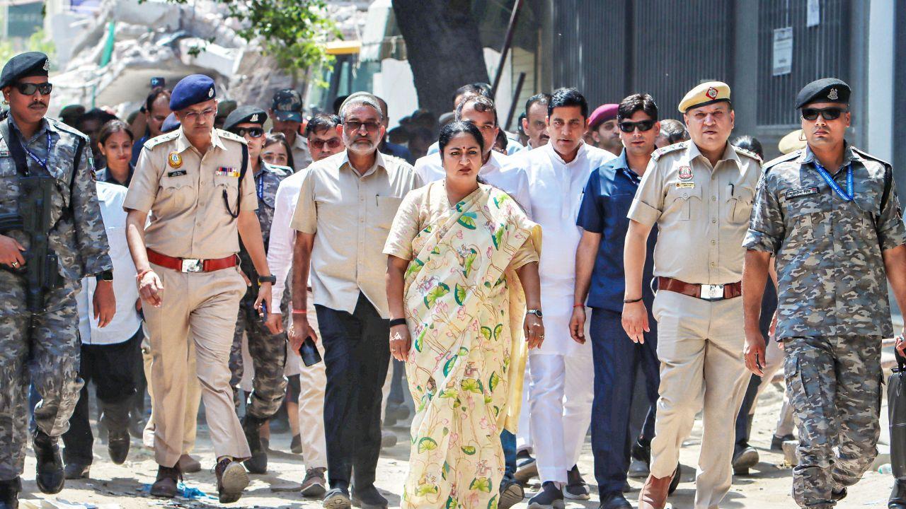Delhi CM Rekha Gupta during a visit to the site after a three-storey commercial building collapsed near Saket Metro station. Pic/PTI